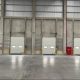Jenis dan Kegunaan Industrial Door dan Dock Leveler dalam Industri